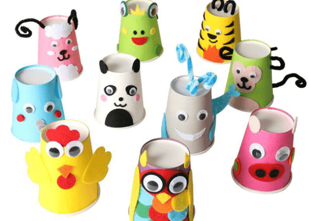 Paper cups with animal faces stuck on 